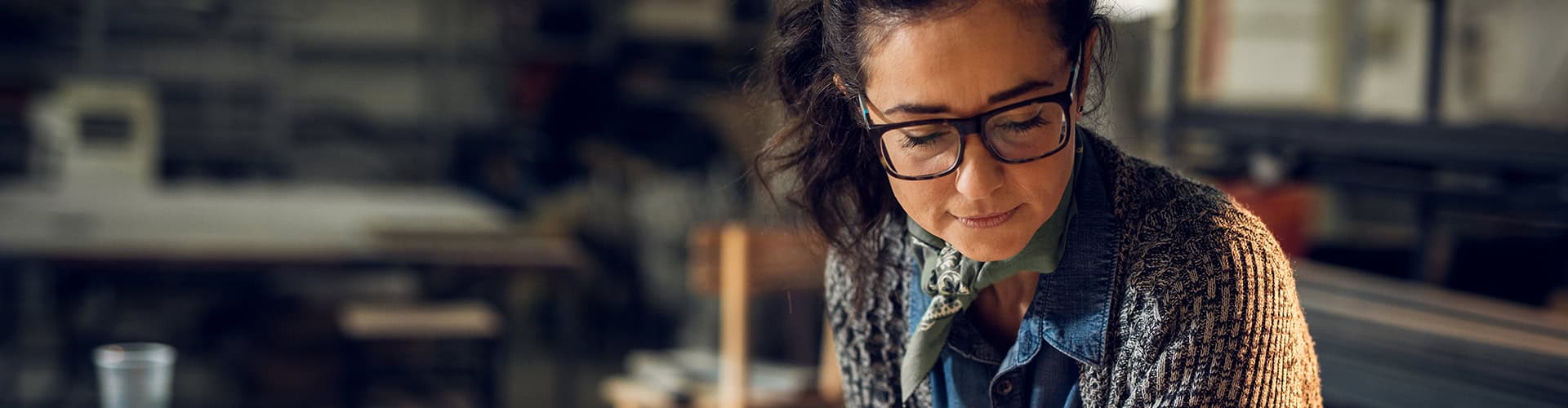 Woman looking at her computer considering a Renovo Construction career